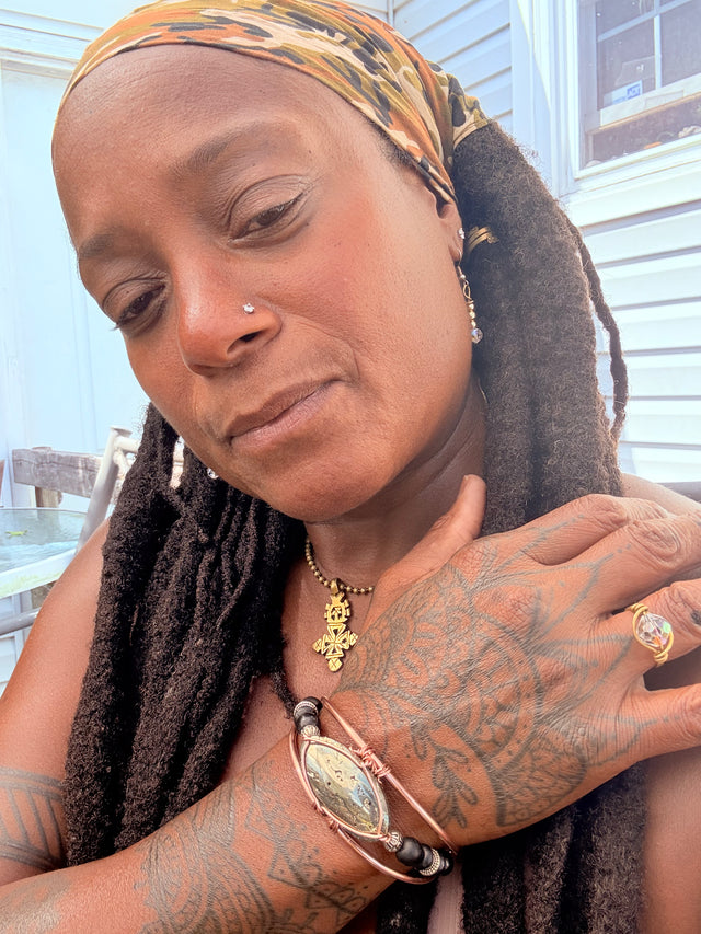 Pyrite shungite copper wire wrapped bracelet melanin trinity of affinity worn by Sista Carla