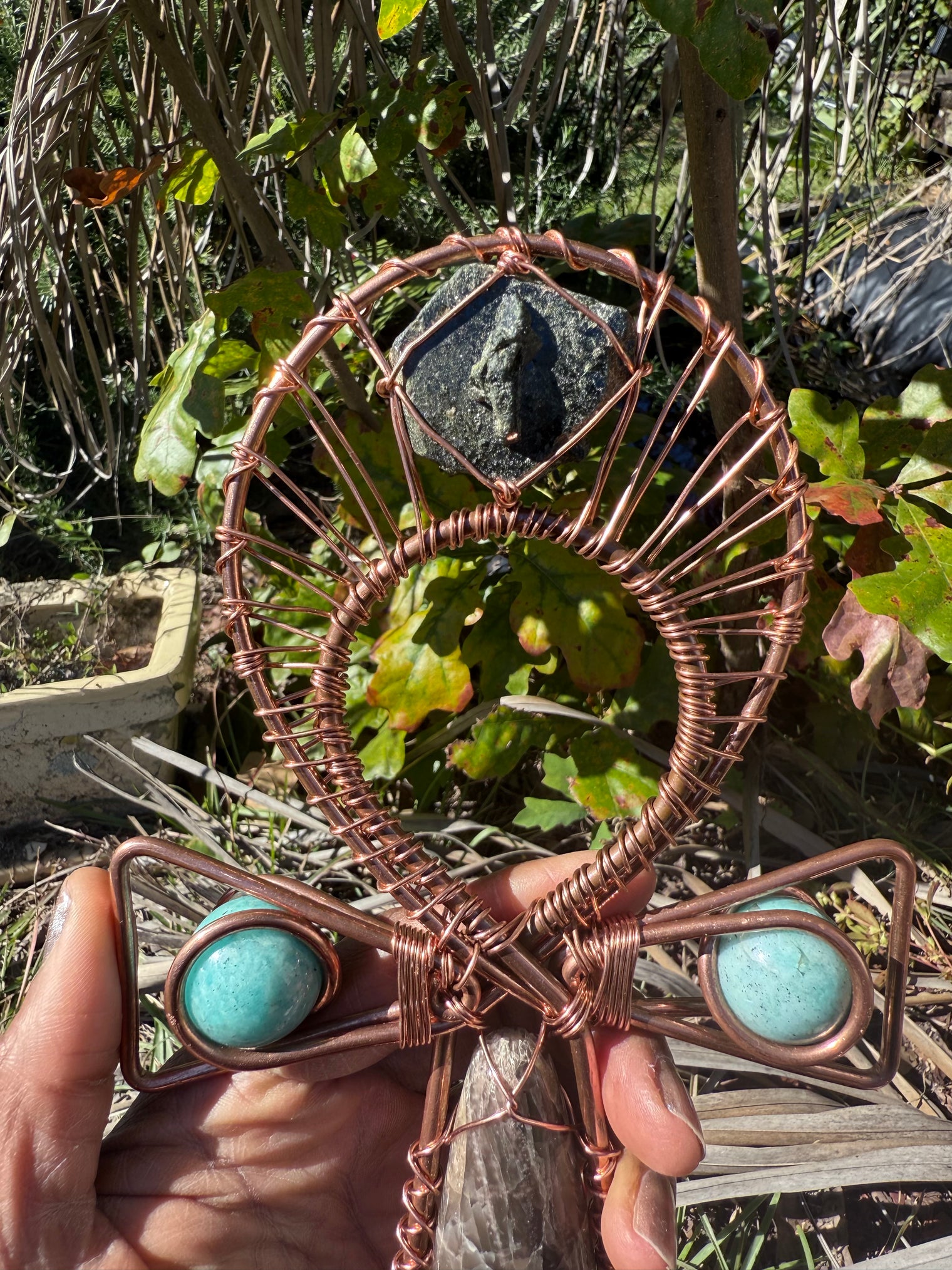 Black moonstone with amazonite spheres on the arms and epidote at the top of a 9.5 in copper wirewrapped ankh