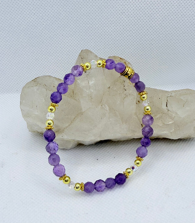 This Amethyst bracelet has 18kt gold plated beads and authentic Swarovski Crystals that add a touch of elegance!