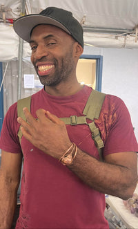 man modeling copper wire wrapped bracetet
